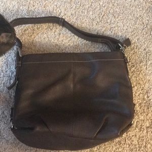 Brown leather Coach purse.